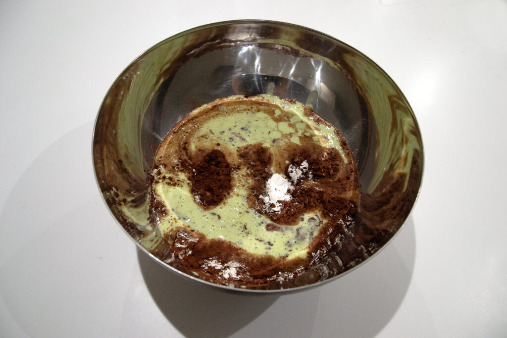 Pour the wet ingredients from blender into the bowl with the dry ones. Also, add the chocolate chips to the mix and stir together until combined.