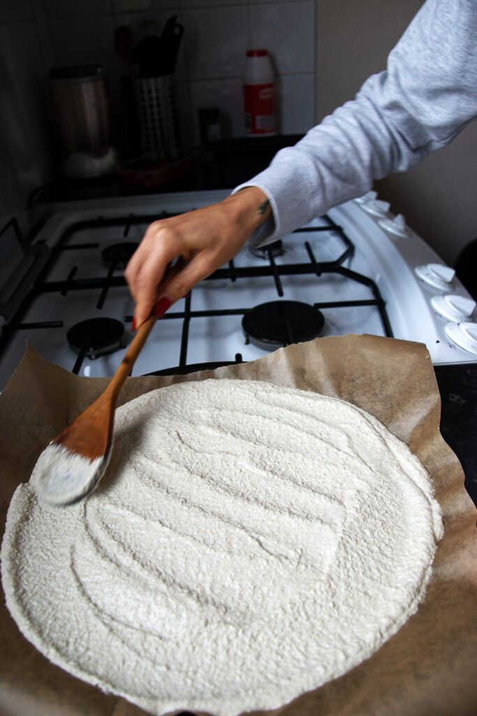 Spread the quinoa mix on to the tray in a pizza shape and bake it at 200° for 20 mins